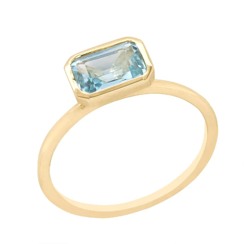 Elegant Designs, Unbeatable Discounts – Shop Jewelry Now YELLOW GOLD FASHION RING WITH EMERALD CUT BLUE TOPAZ